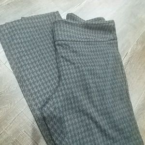 Long, black, herringbone pattern dress pants.